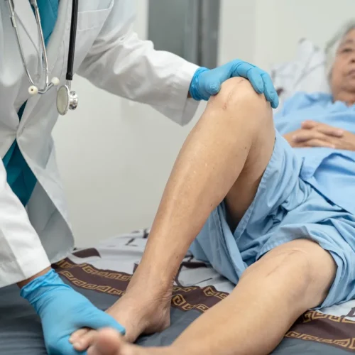 asian-doctor-physiotherapist-examining-massaging-2023-11-27-05-19-22-utc-Large (2)